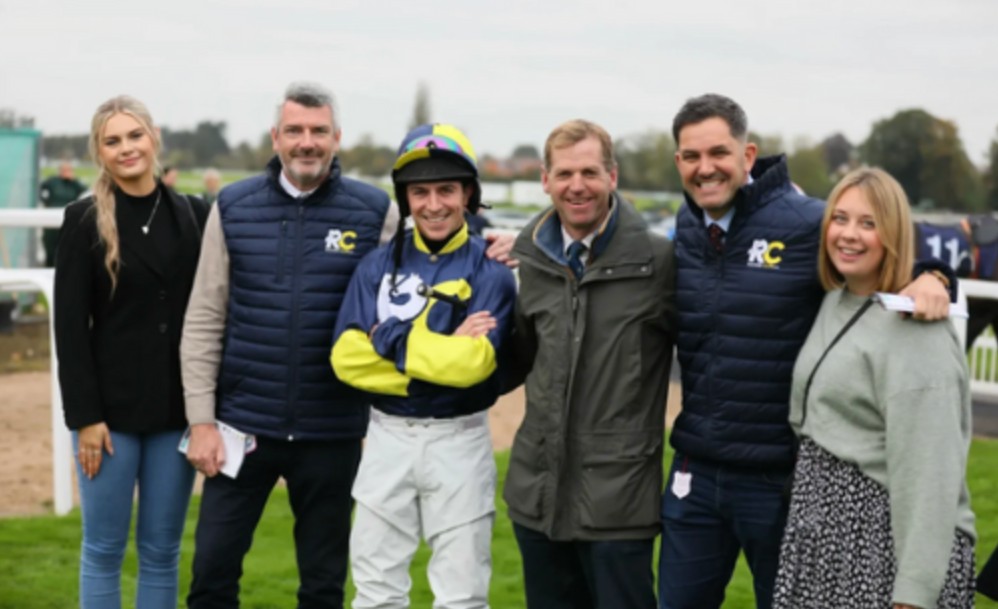 Group of people with a jockey